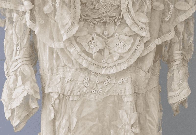 Before image of old vintage dirty wedding dress, before cleaning
